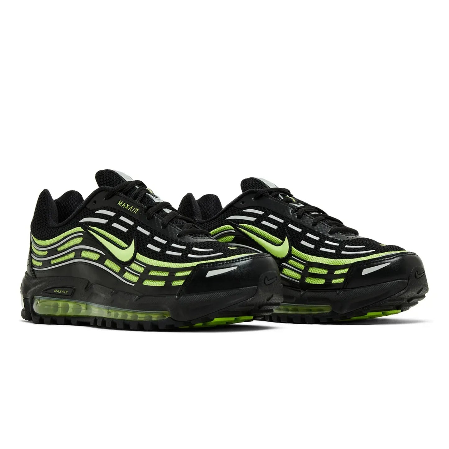 Black and green Nike sneakers on a white background