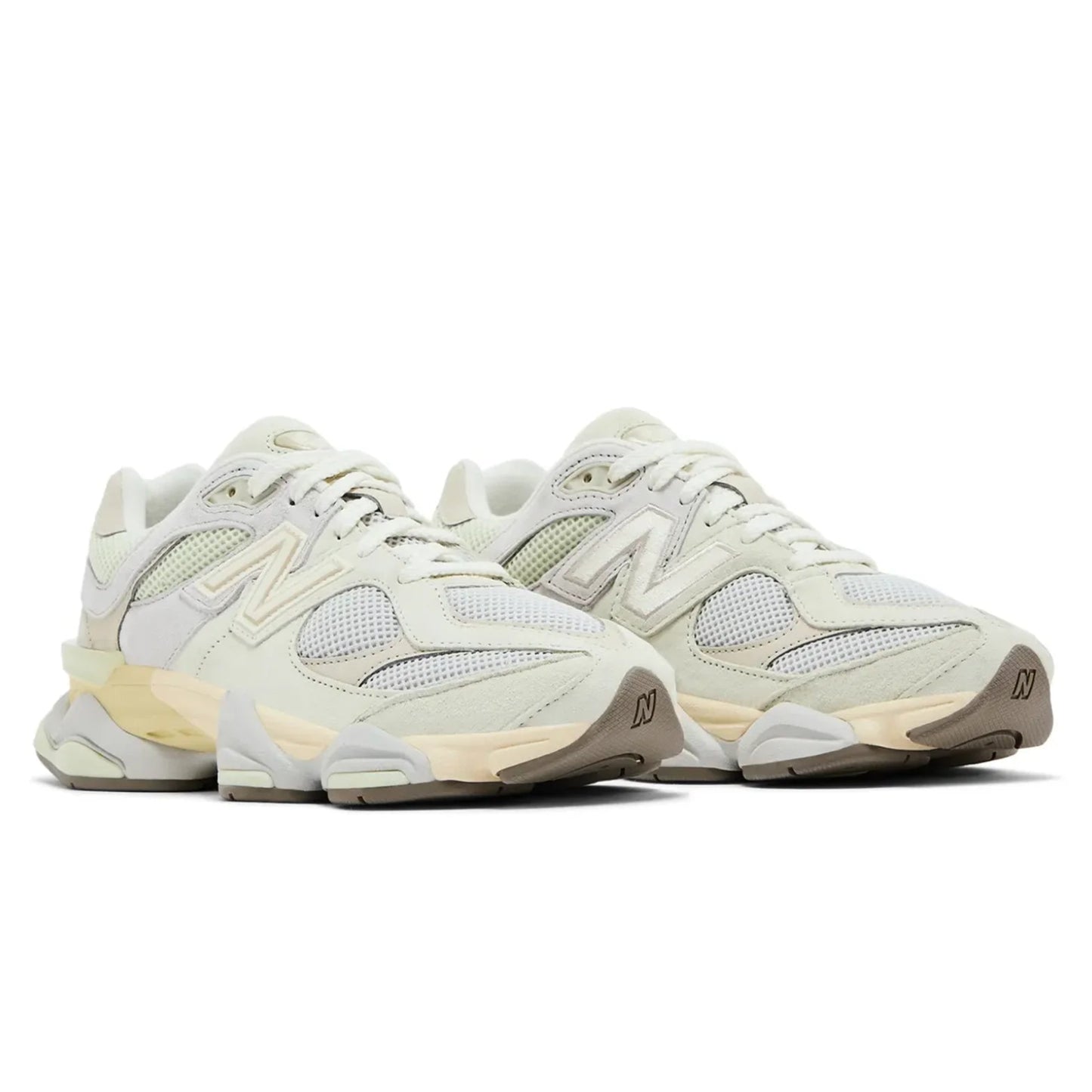 Pair of light-colored sneakers on a white background