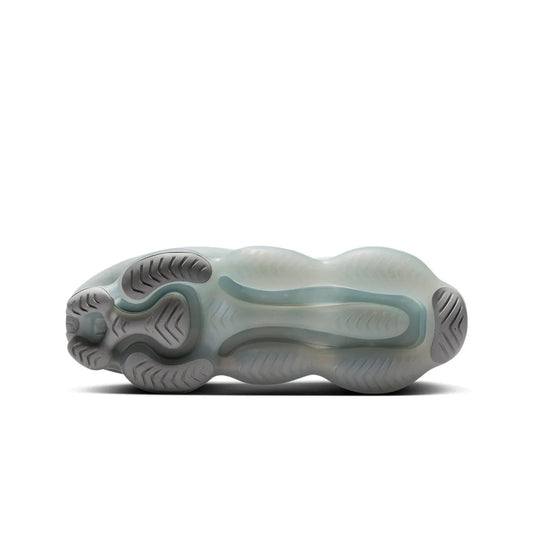 Side view of a shoe with a unique sole design on a white background