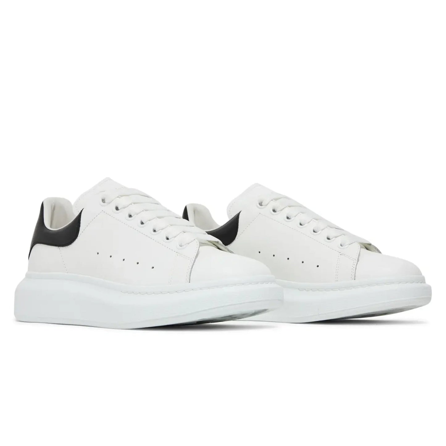 White sneakers with black accents on a white background