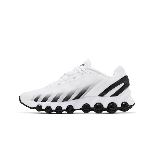 White athletic shoe with black accents on a white background