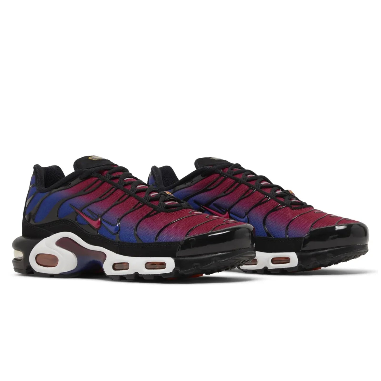 Pair of colorful sneakers with gradient design on a white background