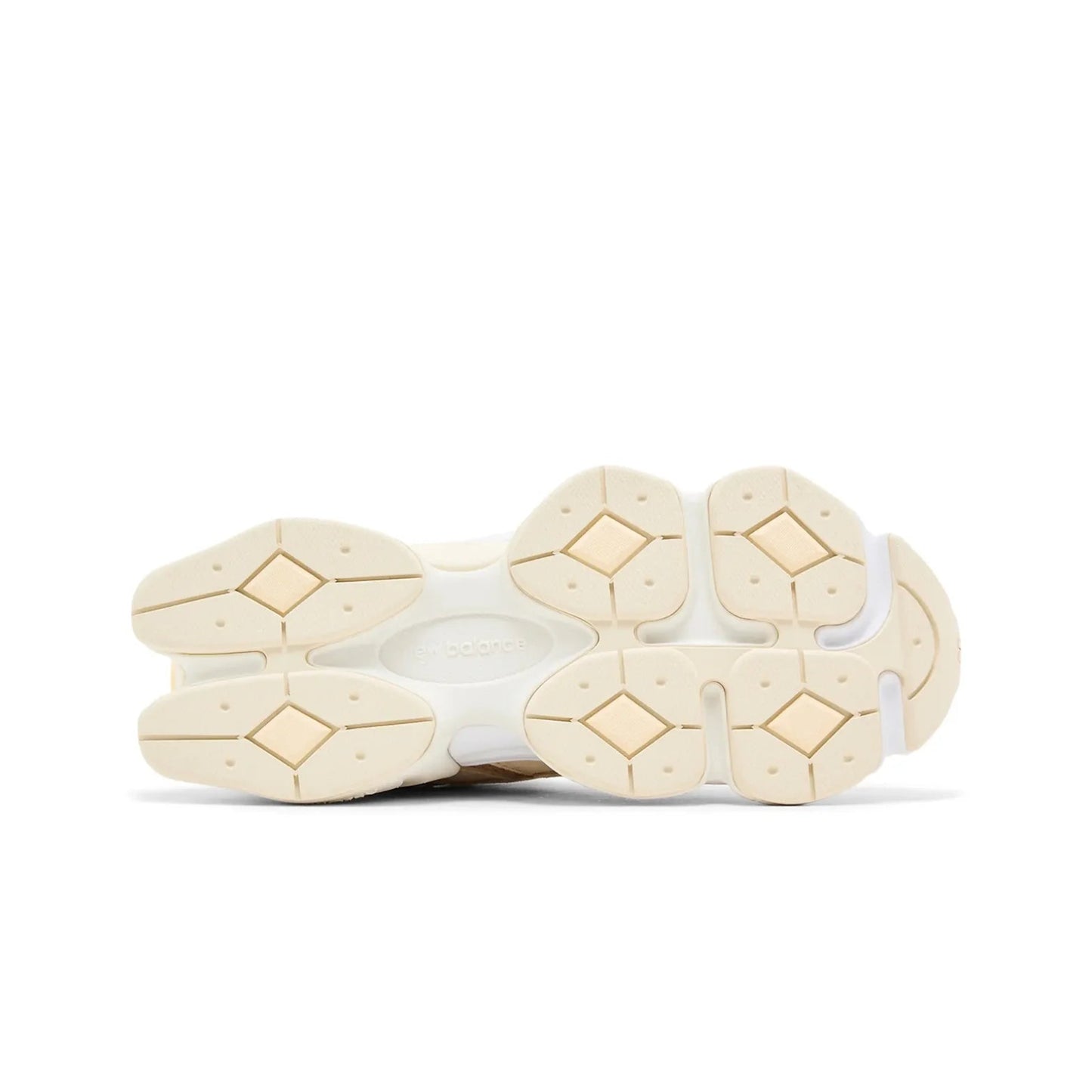 Close-up of beige shoe soles on a white background