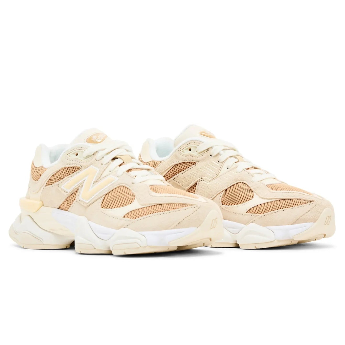 Pair of beige sneakers on a white background