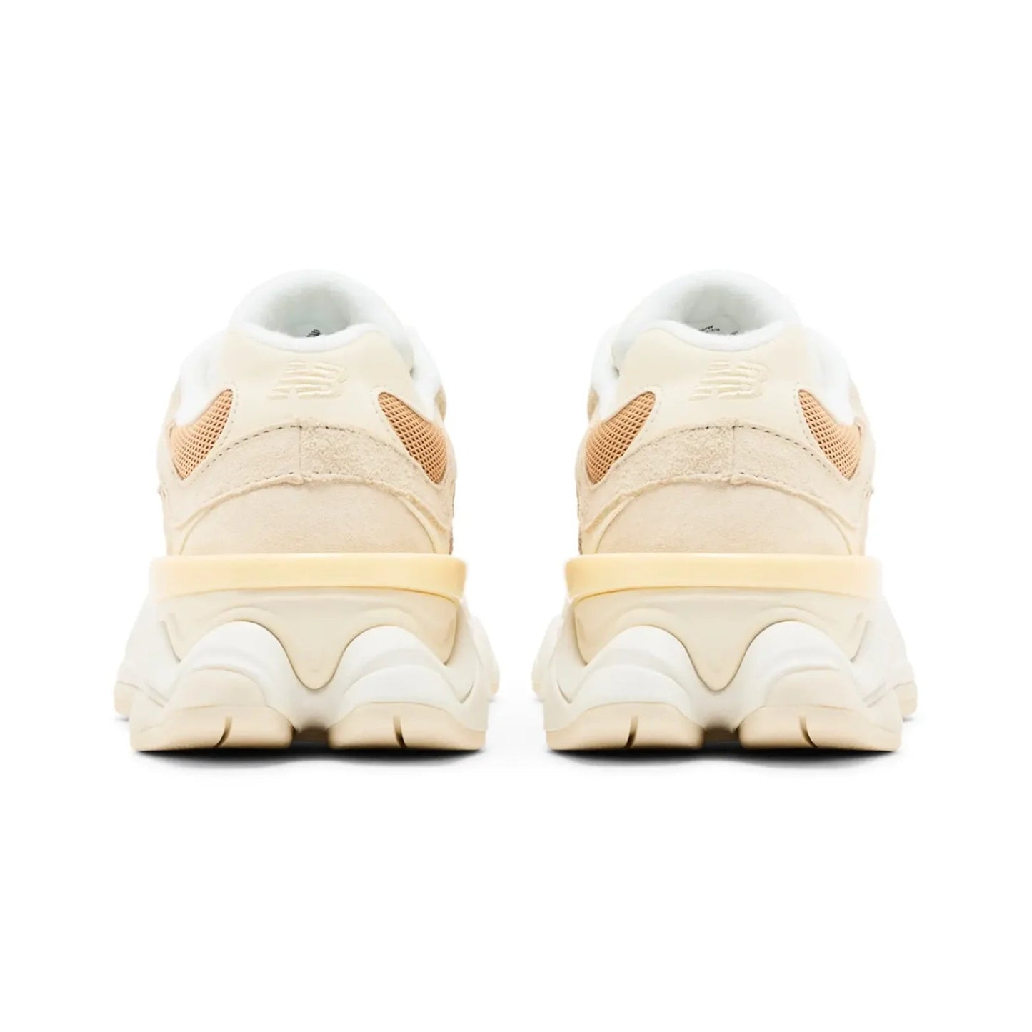 Pair of beige sneakers with a white sole on a white background
