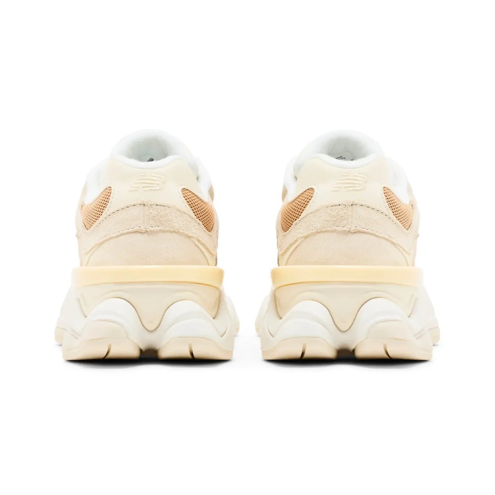 Pair of beige sneakers with a white sole on a white background