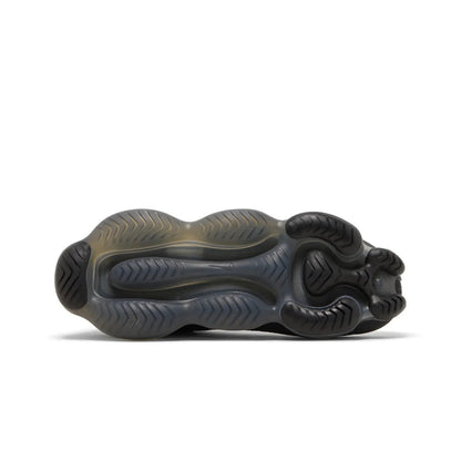 Black sneaker with unique sole design on a white background