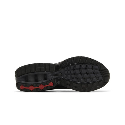 Black shoe sole with red accents on a white background