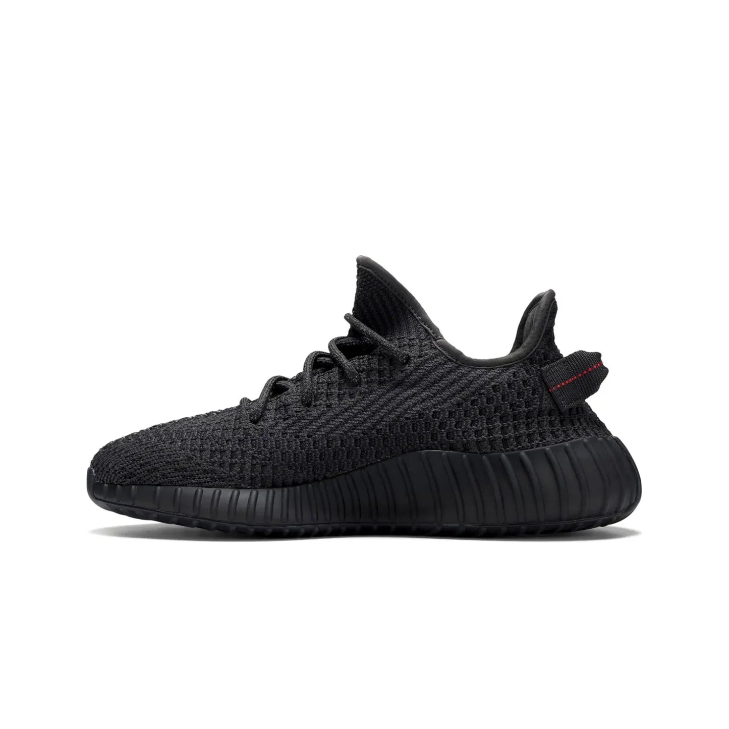 Black sneaker with a red tag on a white background