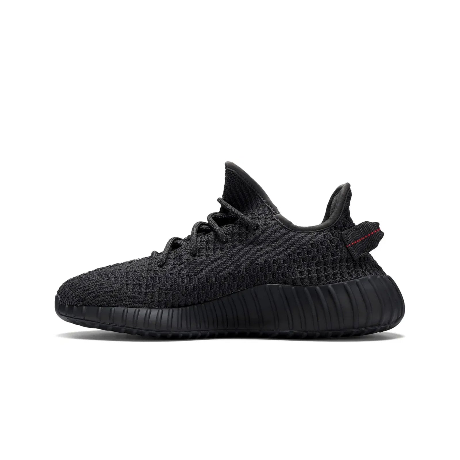 Black sneaker with a red tag on a white background