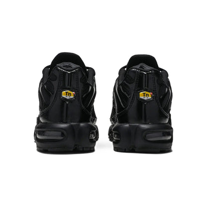 Black sneakers with a brand logo on the back on a white background