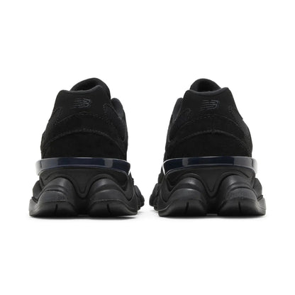Black sneakers with a focus on sole design on a white background