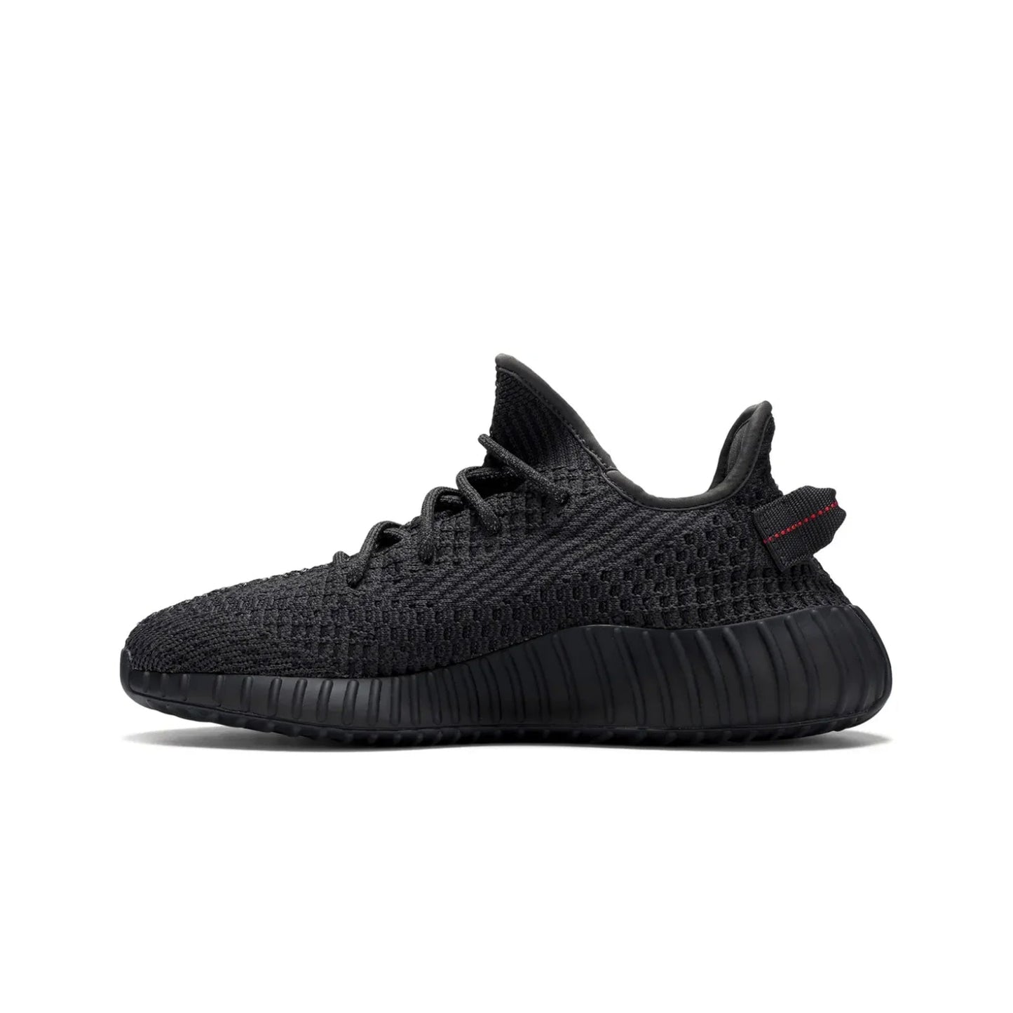 Black sneaker with a red label on a white background