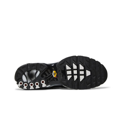 Black and white sole of a shoe with brand logo on a white background