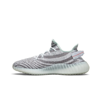 Gray and white sneaker with a visible brand logo on a white background