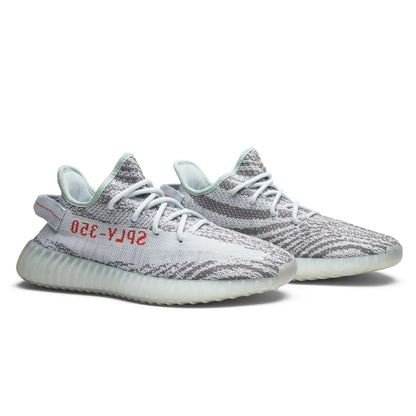 Gray and white sneakers with red text on a white background