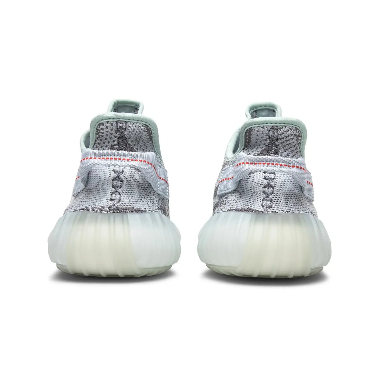 Pair of white sneakers with gray accents on a white background