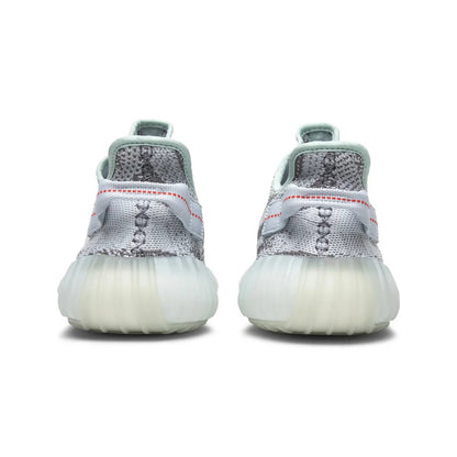 Pair of white sneakers with gray accents on a white background