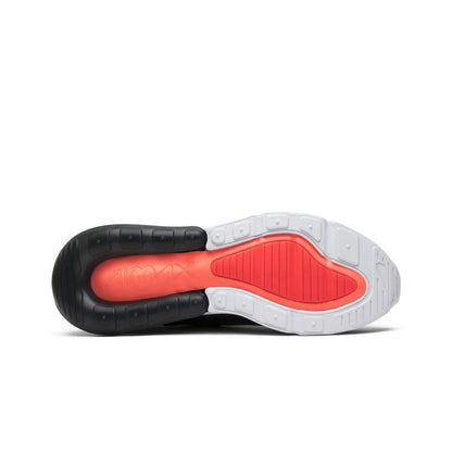 Sole of a shoe with black, red, and white color scheme on a white background