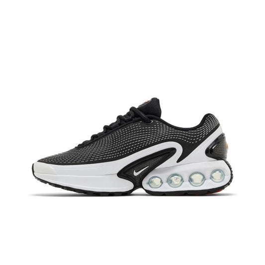 Black and white sneaker with unique sole design on a white background