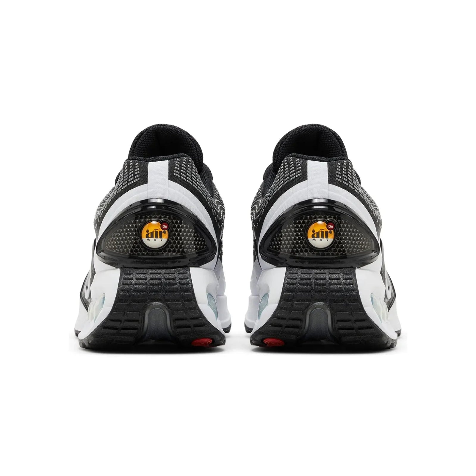 Black and white athletic shoes with visible brand logo on a white background