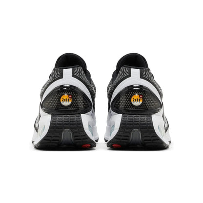 Black and white athletic shoes with visible brand logo on a white background