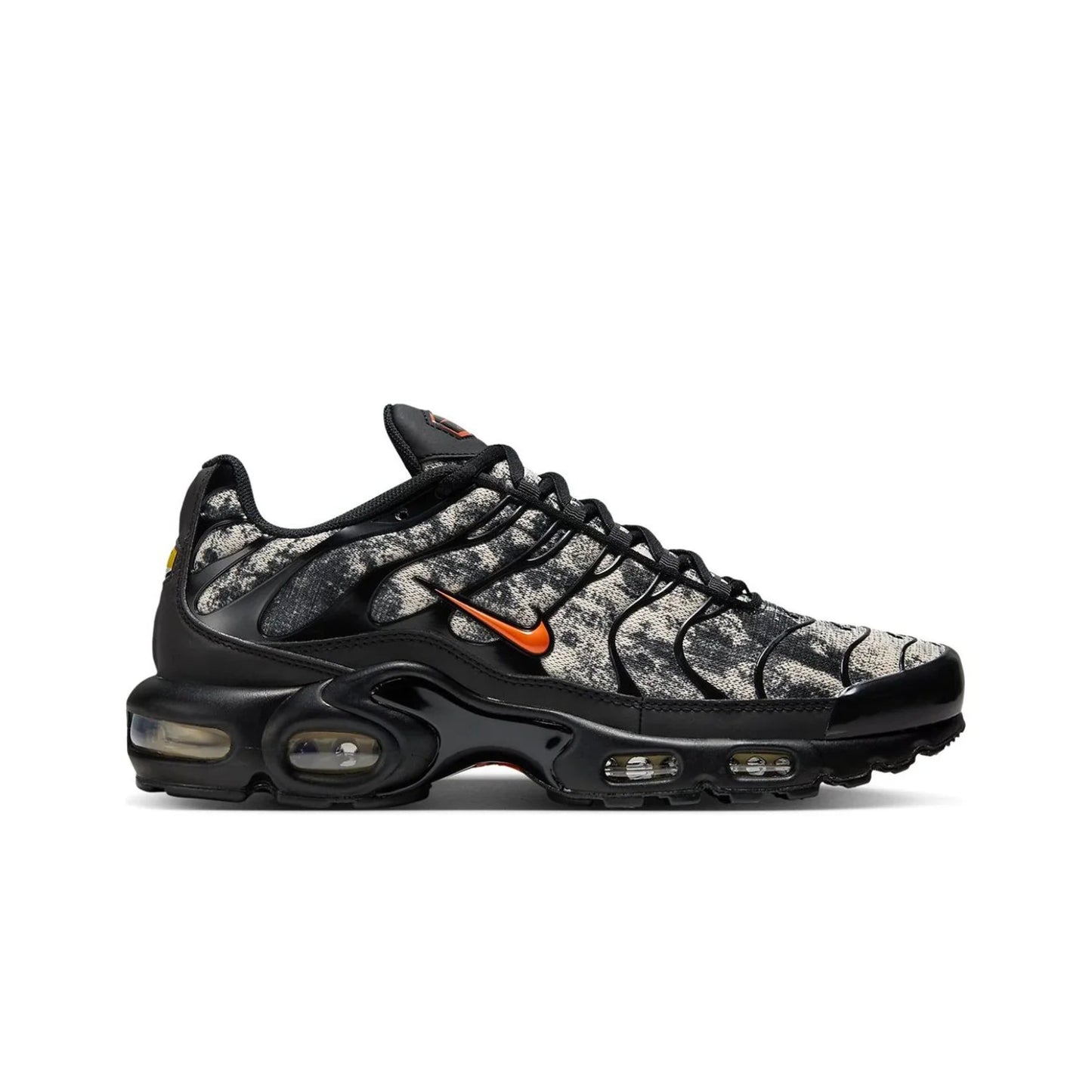 Black and gray sneaker with orange accents on a white background