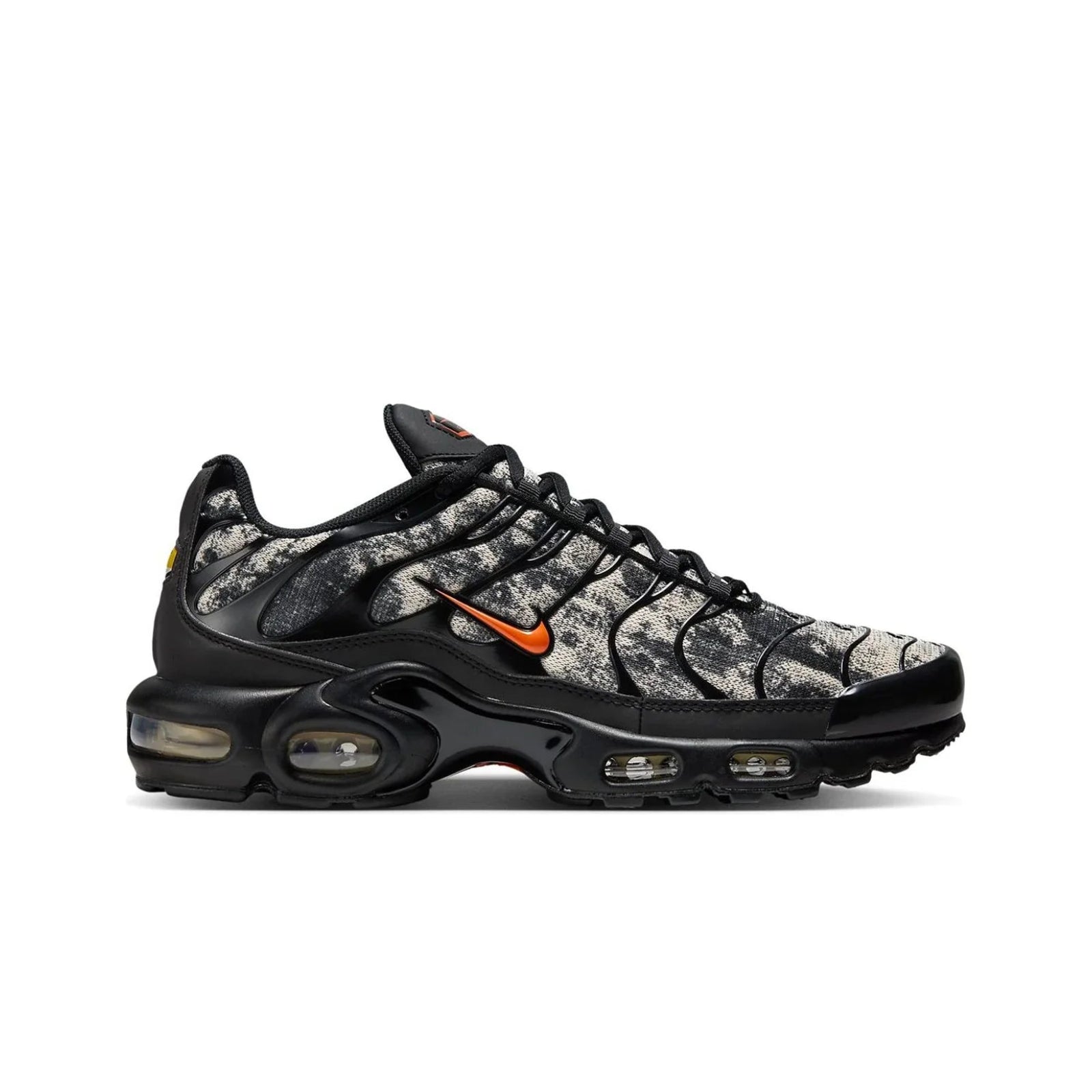 Black and gray sneaker with orange accents on a white background