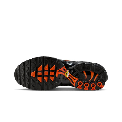 Black and orange sole of a shoe on a white background
