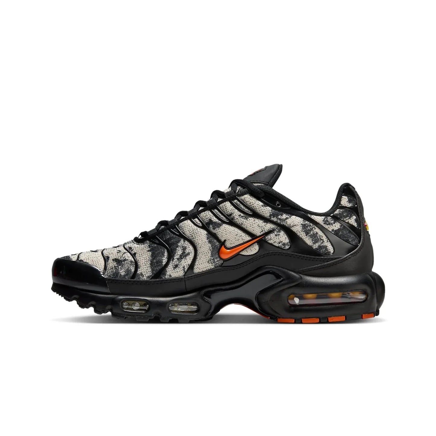 Black and gray sneaker with orange accents on a white background