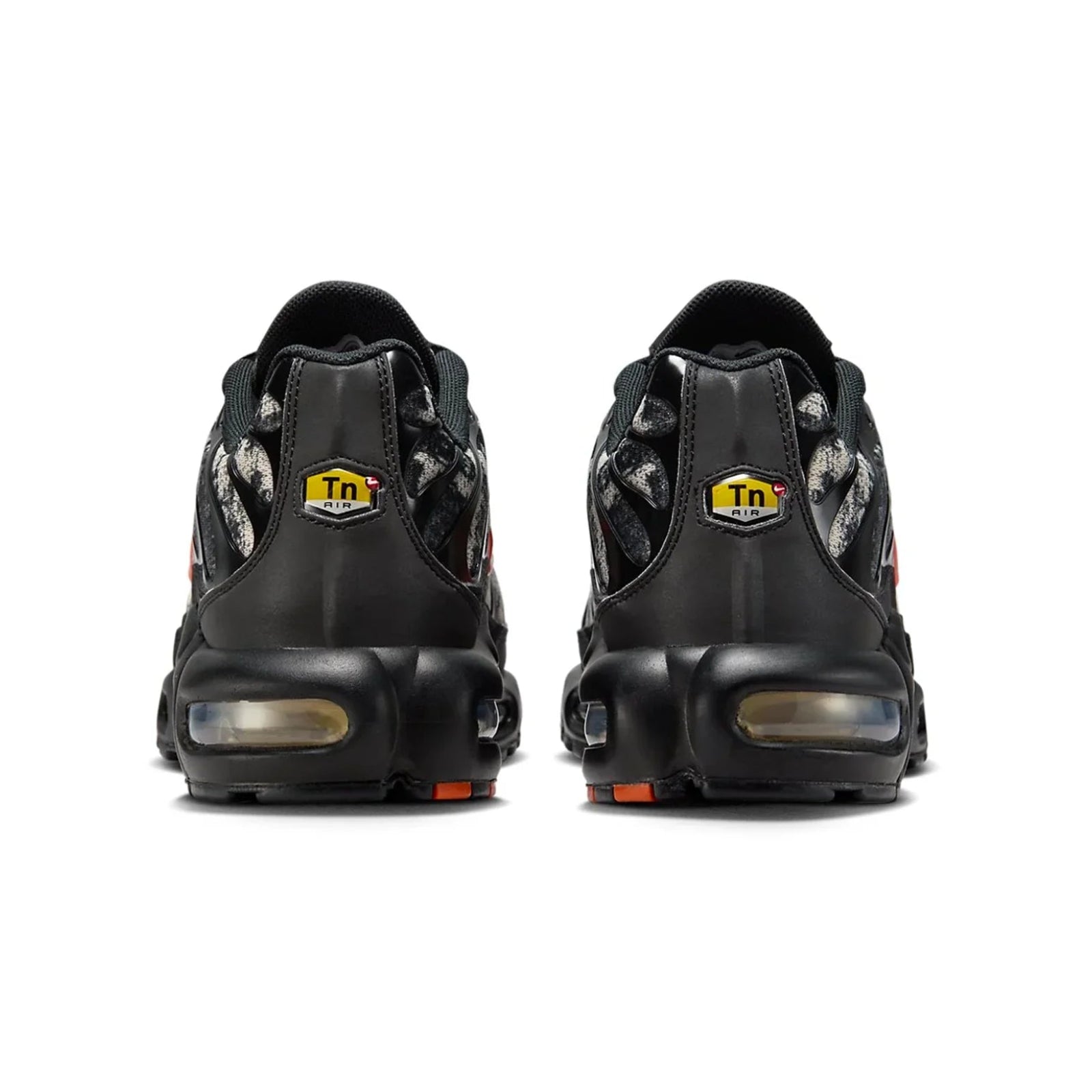 Black sneakers with a visible brand logo on a white background