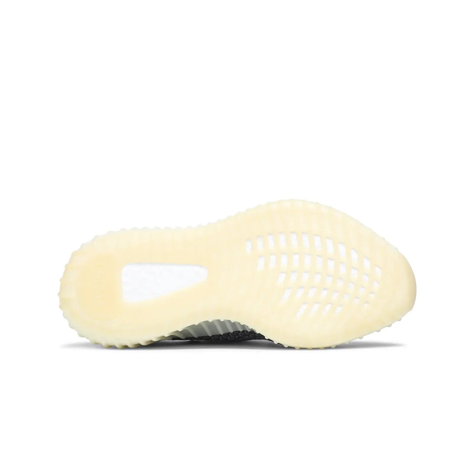 Sneaker with textured sole on a white background