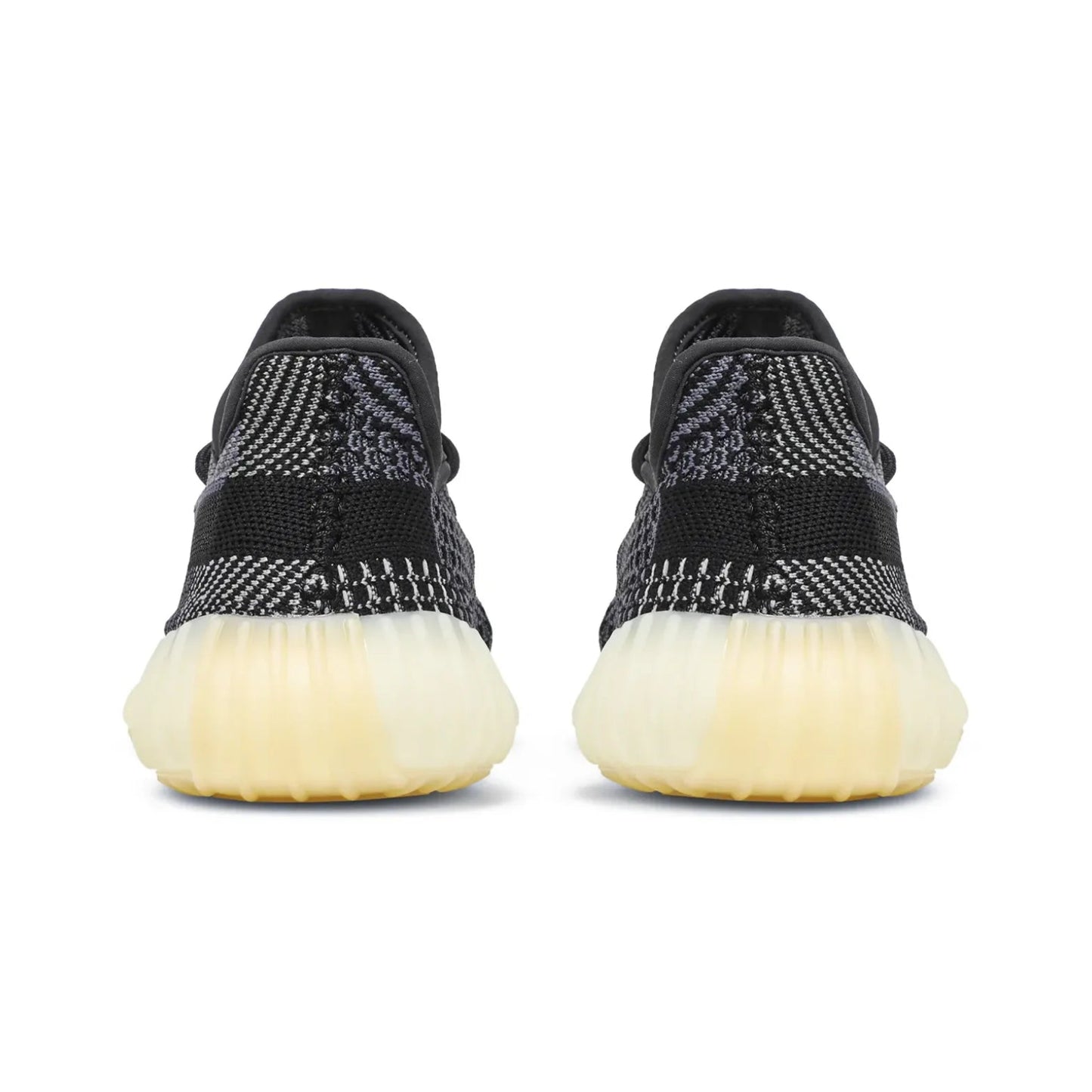 Black sneakers with white soles on a white background