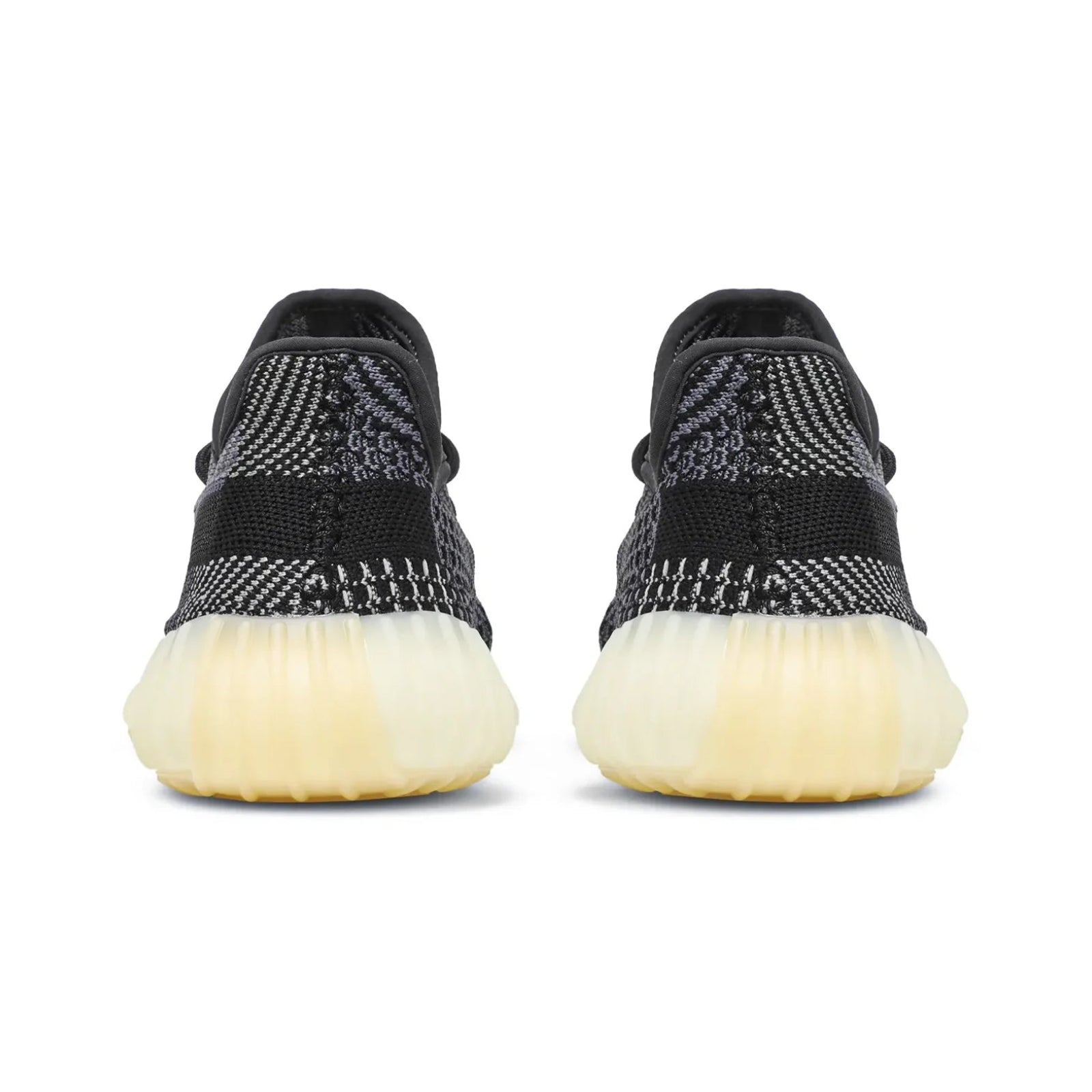 Black sneakers with white soles on a white background