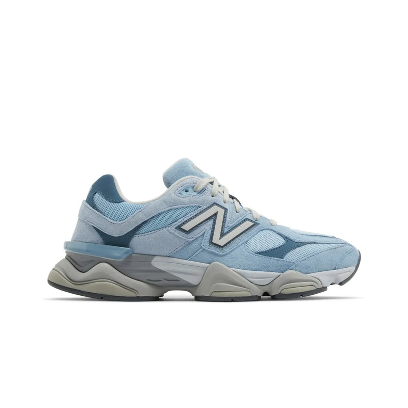 Light blue sneaker with a brand logo on a white background