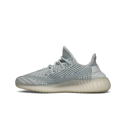 Gray sneaker with a white sole on a white background