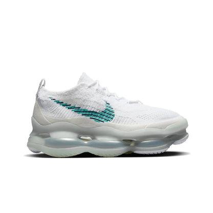 White sneaker with green accents on a white background