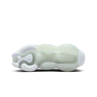 Light green and white shoe on a white background