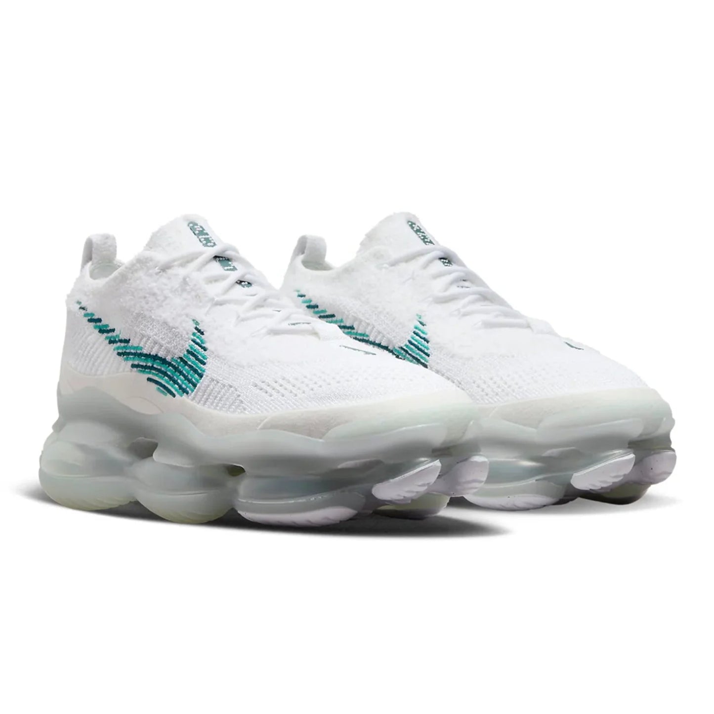 White sneakers with teal accents on a white background