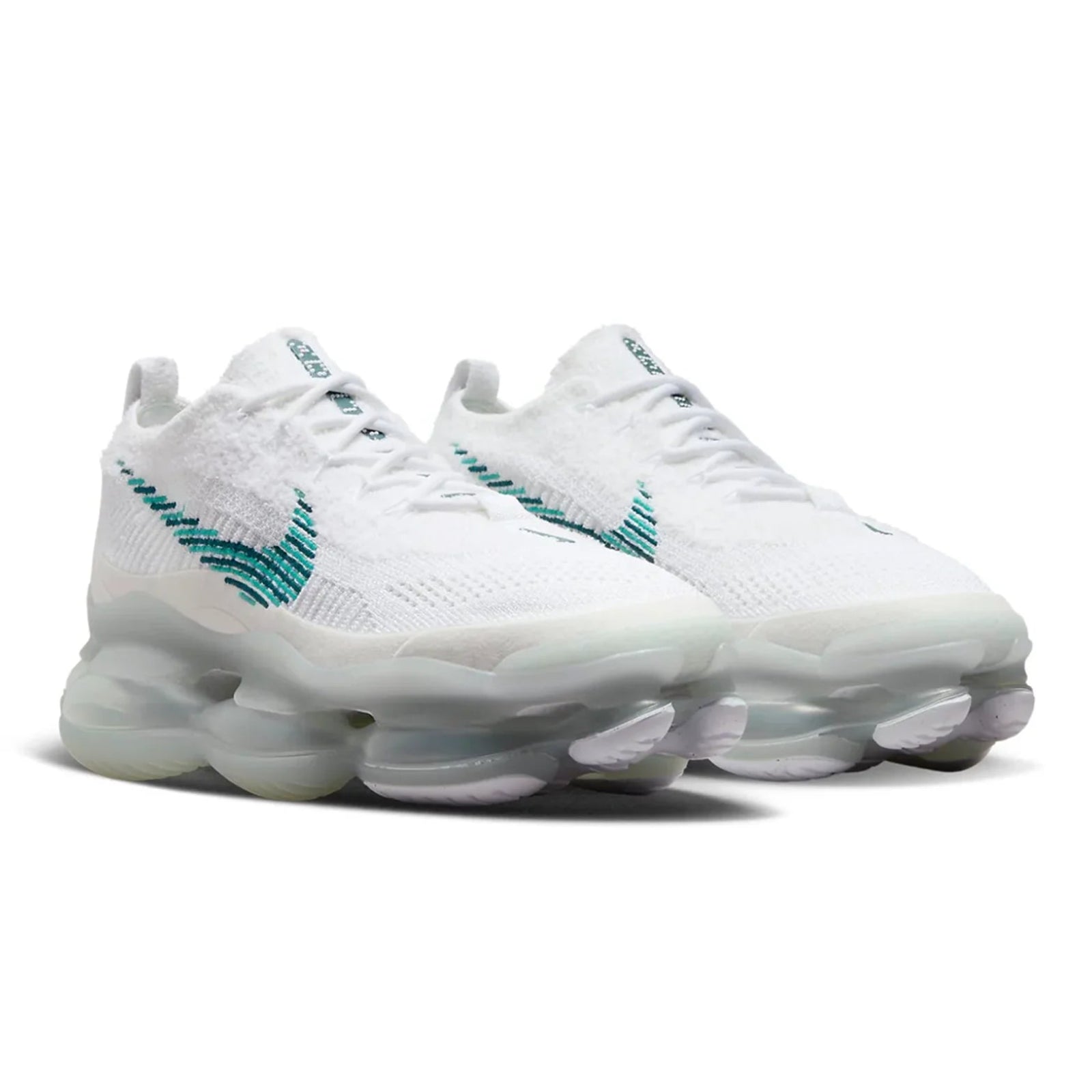 White sneakers with teal accents on a white background