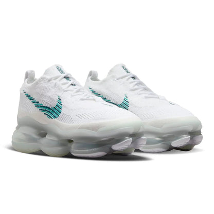 White sneakers with teal accents on a white background