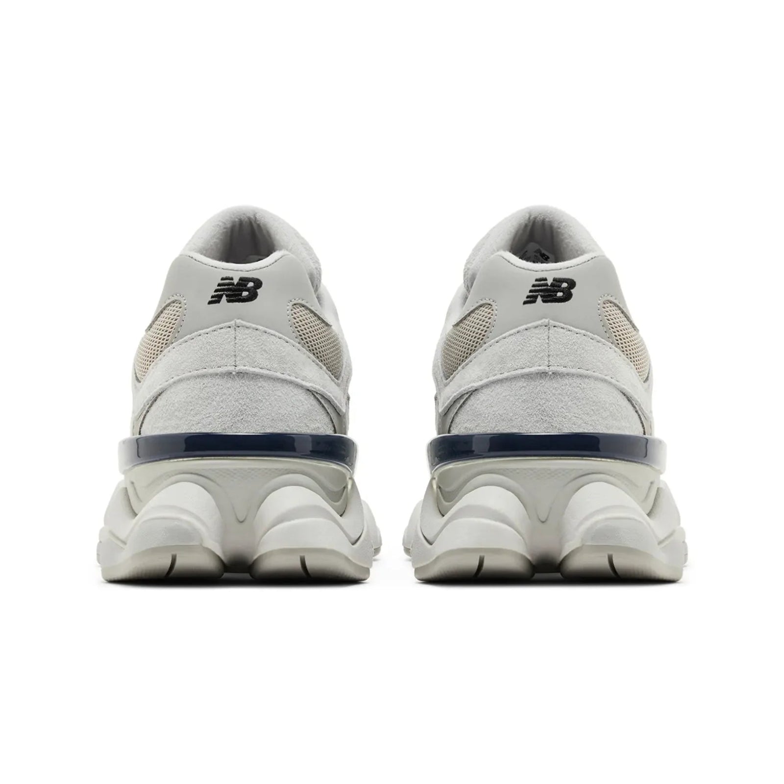 White New Balance sneakers with blue accents on a white background