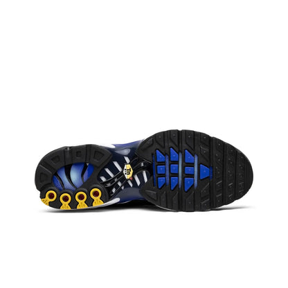 Close-up of a shoe sole with blue and yellow accents on a white background