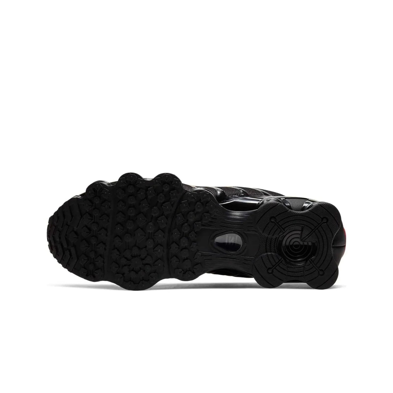 Black sneaker sole with tread pattern on a white background
