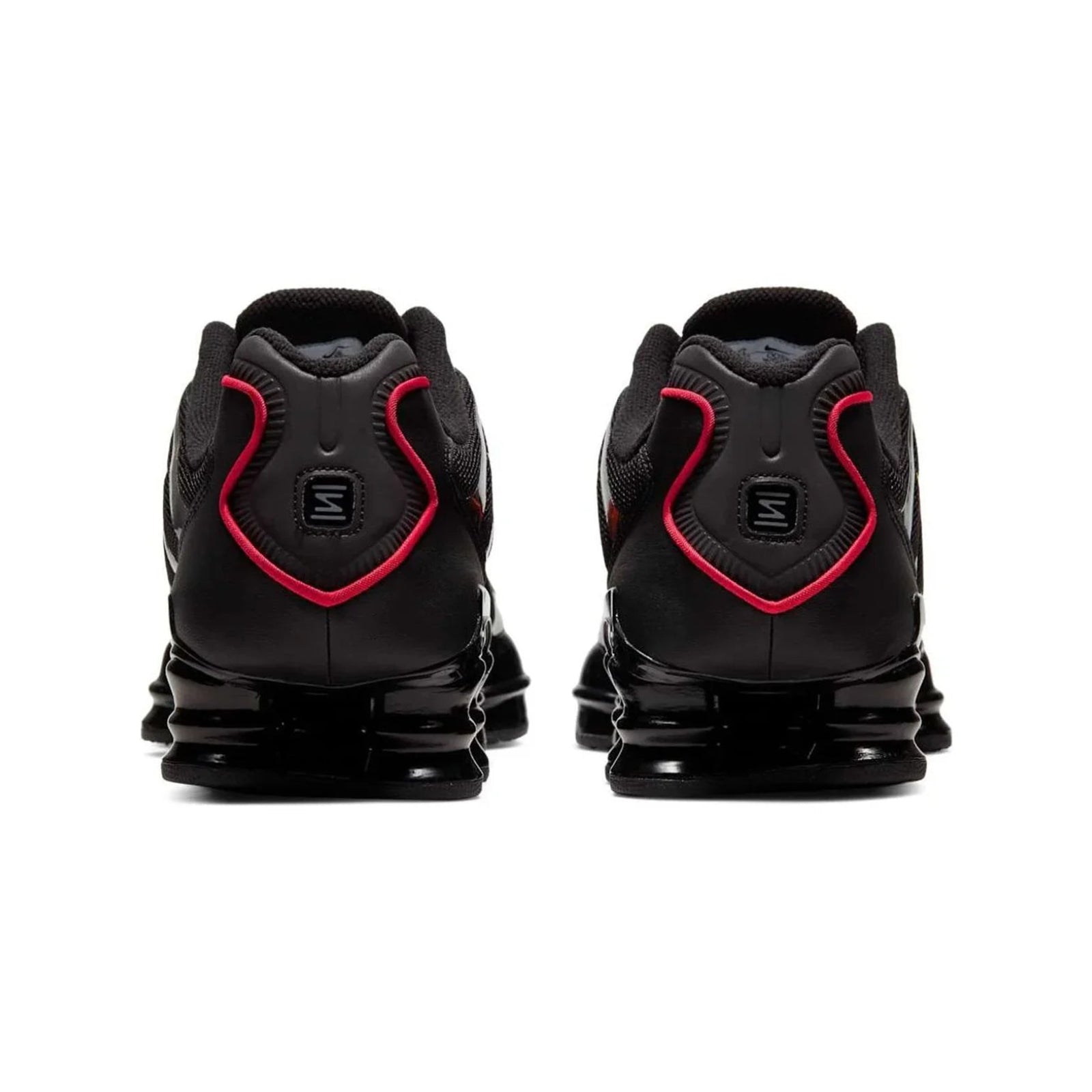 Black and red athletic shoes with unique sole design on a white background