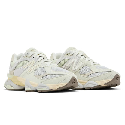 Pair of light-colored sneakers on a white background