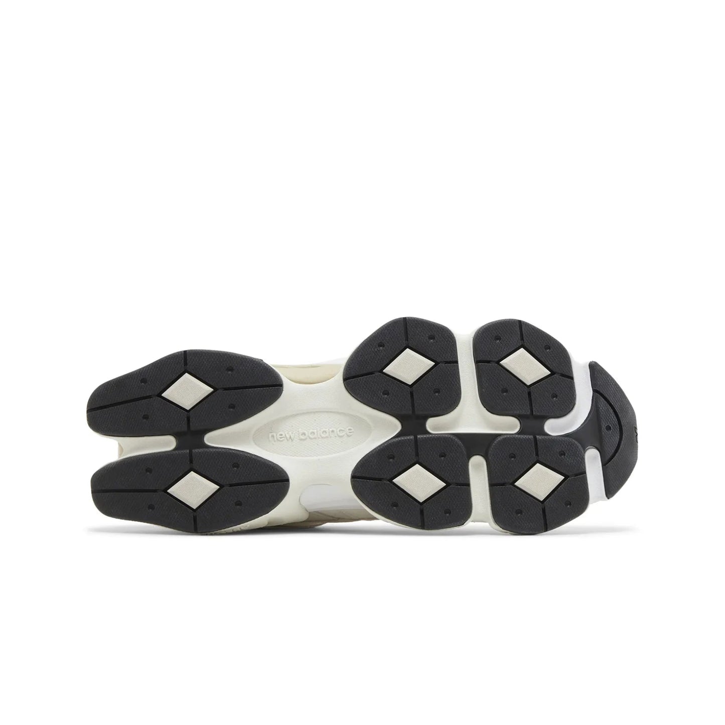 Close-up of a shoe sole with black and white tread pattern on a white background