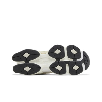 Close-up of a shoe sole with black and white tread pattern on a white background