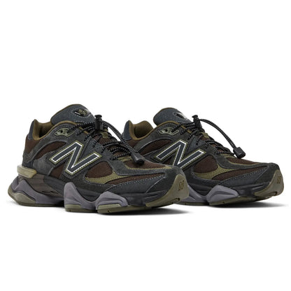 Pair of brown and gray sneakers with New Balance logo on a white background