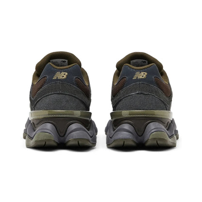 Pair of dark gray and brown shoes on a white background